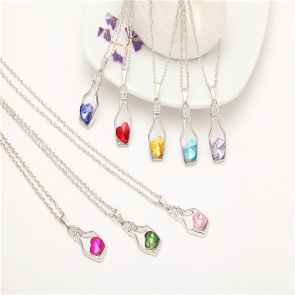 Brand new necklace with Love Drift wine perfume bottle pendant. Blue